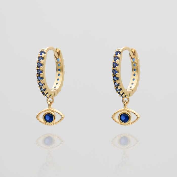 gold evil eye huggie earring paved with sapphire