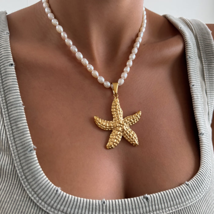 Model wearing a Pearl Necklace with Gold Starfish Pendant