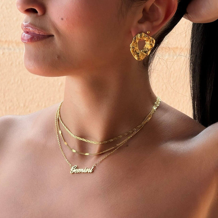 model wearing gizelle textured molten gold earrings from prya