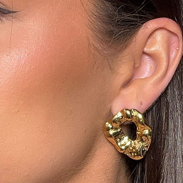 model wearing gizelle textured molten gold earrings from prya
