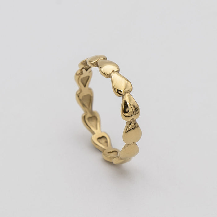Harper Gold plated dainty Ring featuring a charming row of hearts, perfect for ring stacking