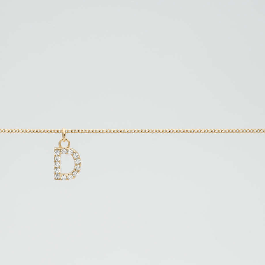 Personalized Samara ICY Initial Belly Chain featuring a sparkling 'D' initial pendant on a delicate gold curb chain.