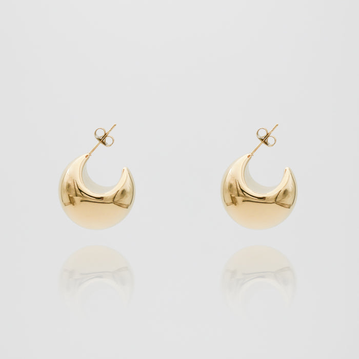 Gold Imani Earrings on white background.