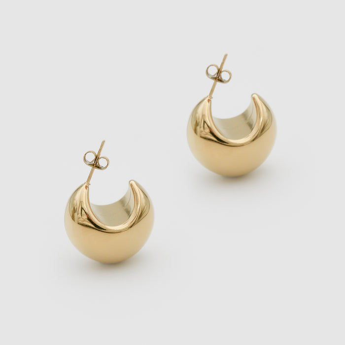 Gold Imani Earrings on white background.