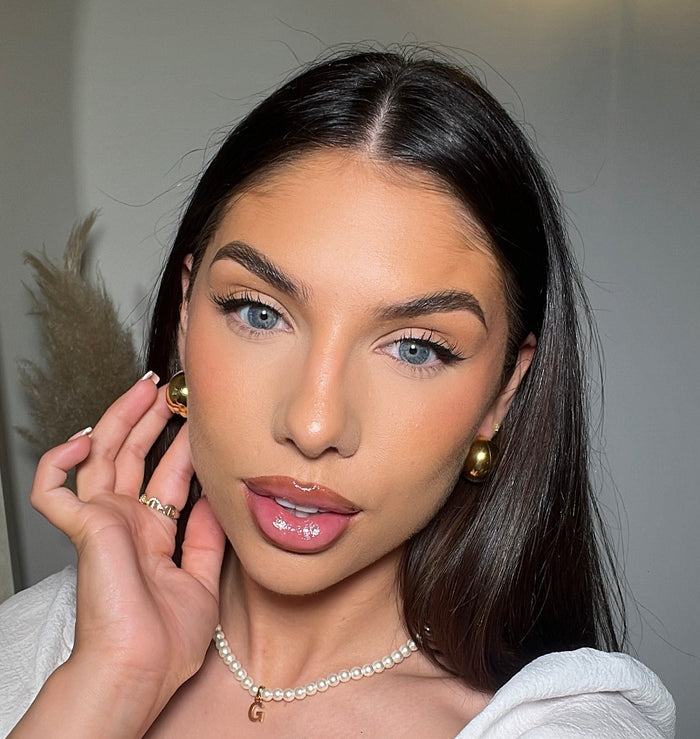 model wearing Gold half hoop Imani Earrings
