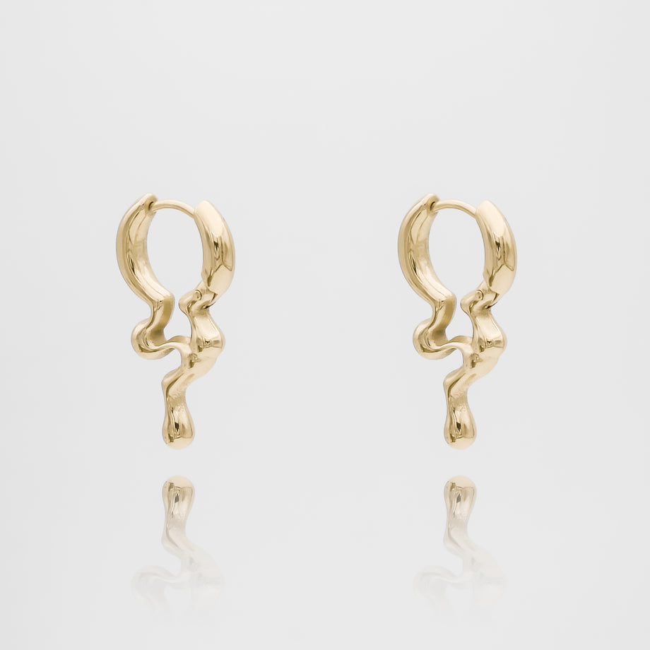 Gold Inez Earrings with abstract design.