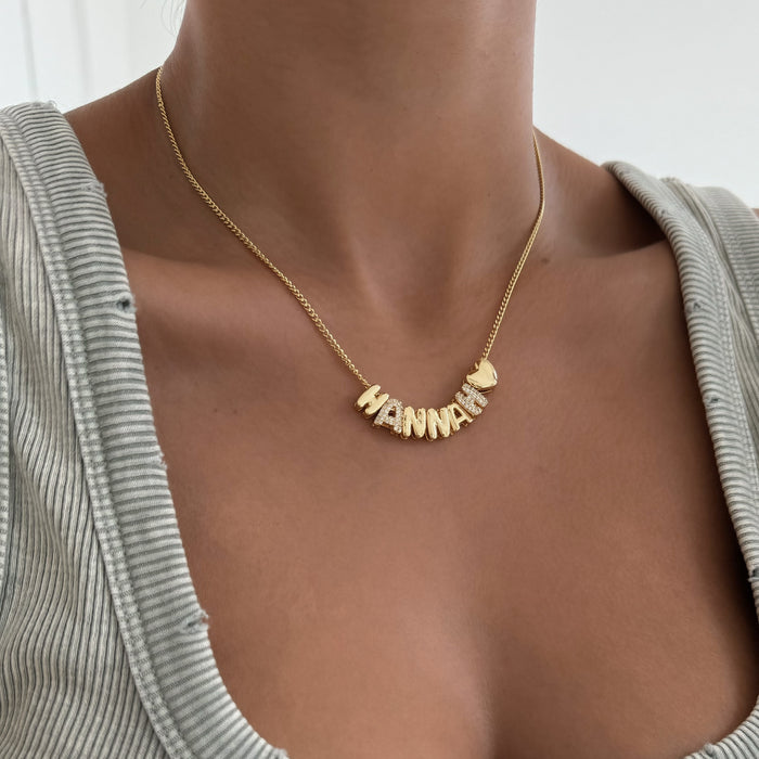 model wearing personalised bubble charm necklace in gold from prya