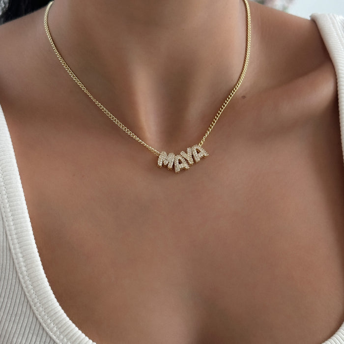 model wearing personalised bubble charm necklace in gold from prya