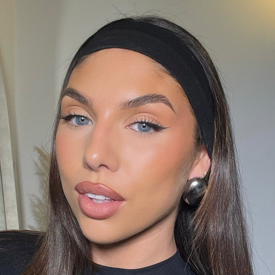 model wearing silver spherical Maeve earrings