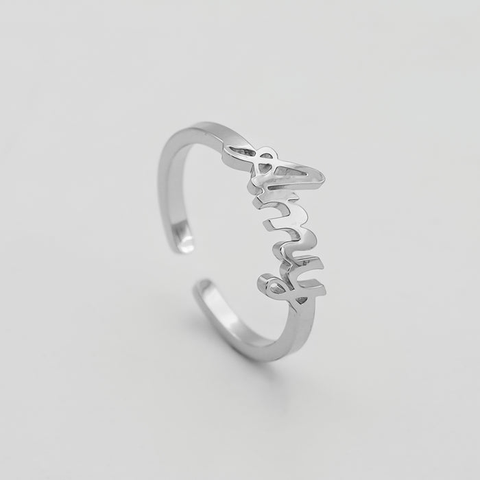 Silver ring with "Amy" in cursive script.