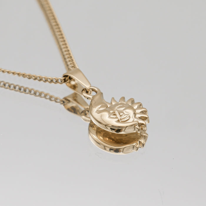 Gold sun and moon pendant necklace.
