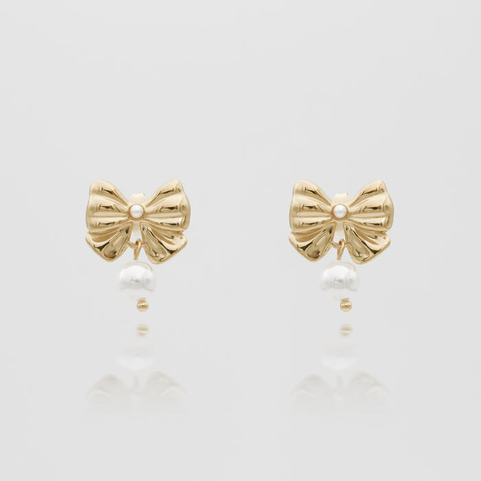 Gold bow earrings with pearls.