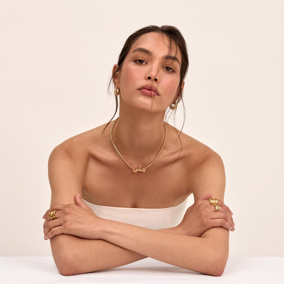 model wearing a PRYA gold Icy Arabic Name Necklace
