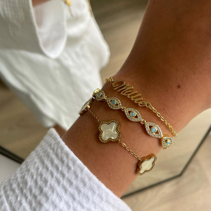 model wearing Gold name bracelet with double chain.