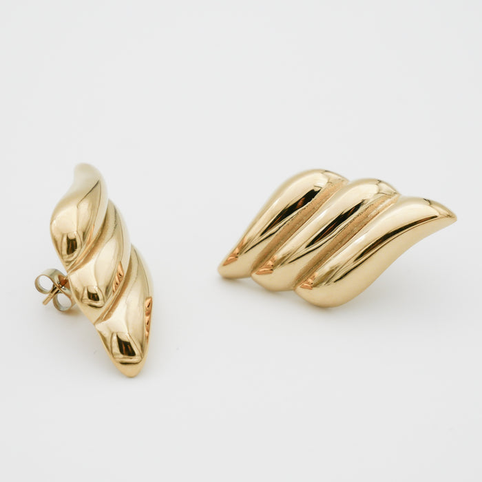 Gold Zaya ribbed Earrings on white background.