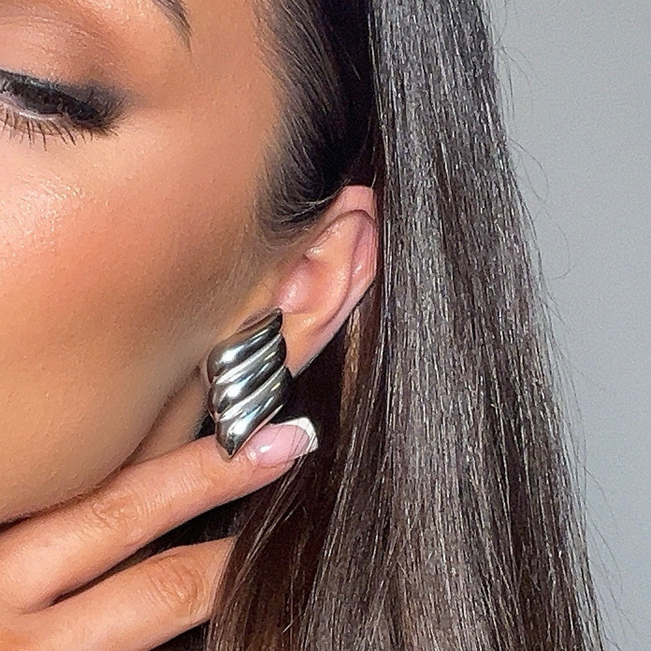 model wearing zaya statement earrings in silver from prya