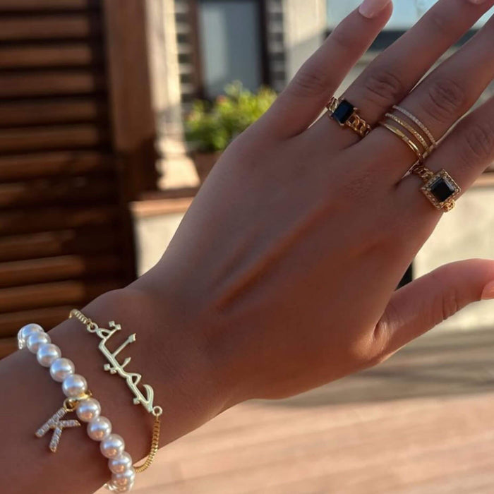 model wearing gold arabic custom name bracelet