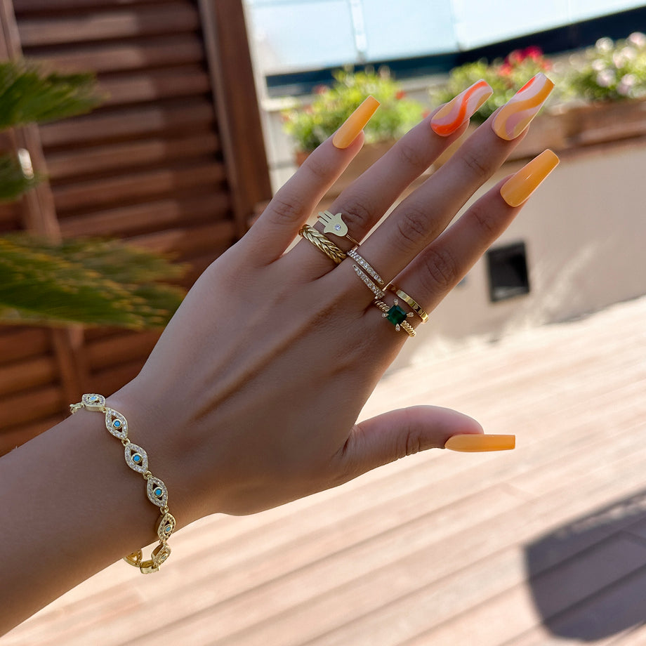 model wearing amallie hand of hamsa ring in gold