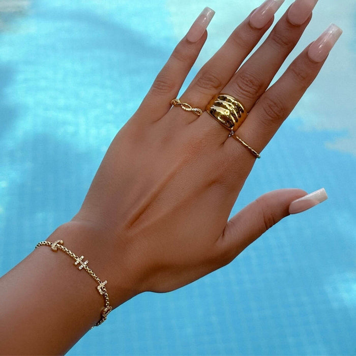 model wearing pave custom name bracelet in the pool