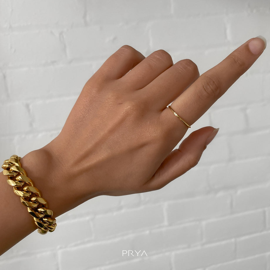 model wearing two gold ring with small cz stones