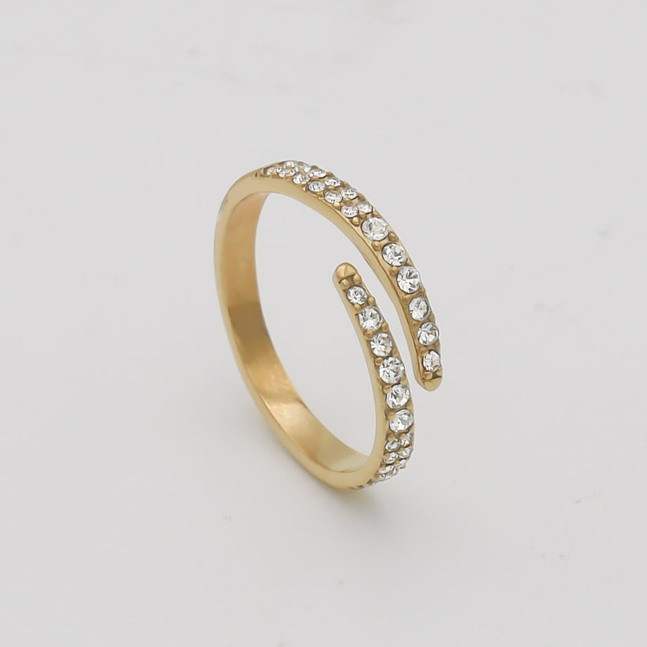 Gold ring with sparkling stones.