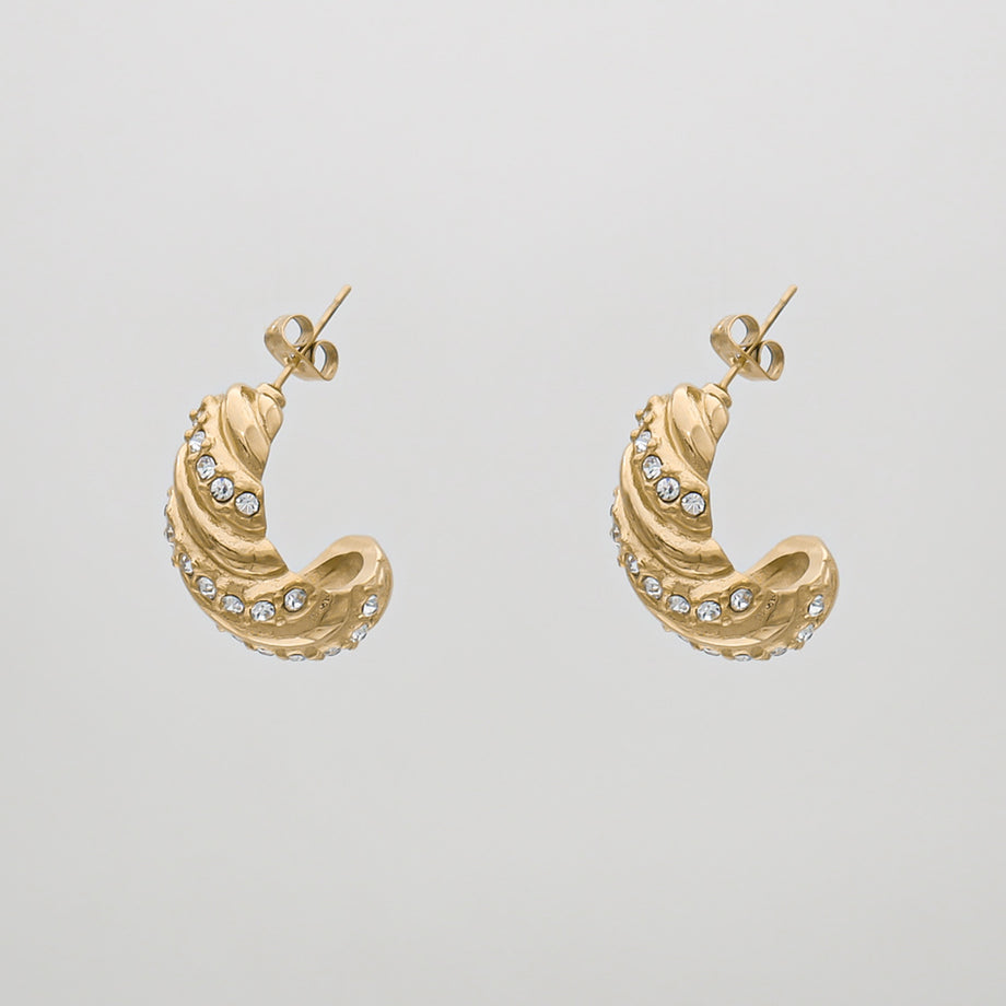 Gold earrings with spiral design and gemstones.