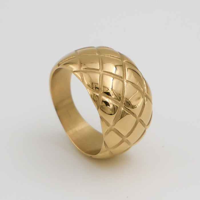 Gold ring with quilted pattern design.