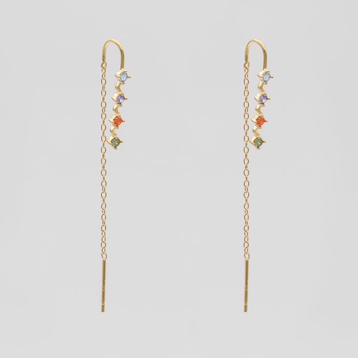 Gold threader earrings with colourful gemstones.