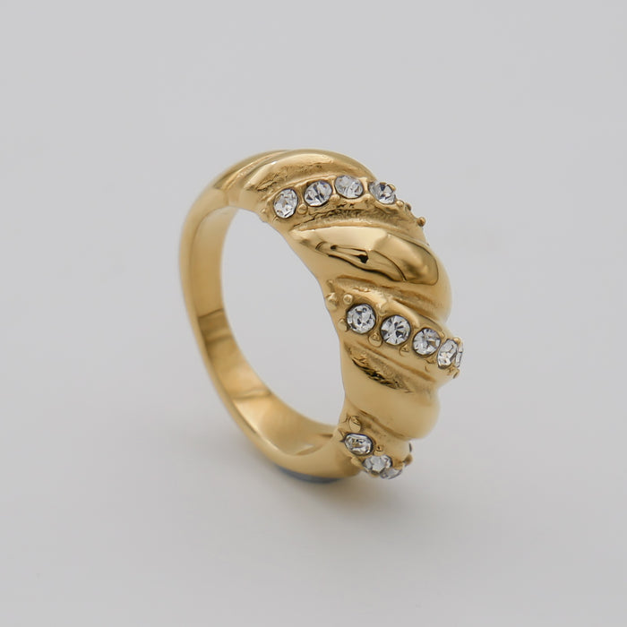 Gold ring with crystal embellishments.