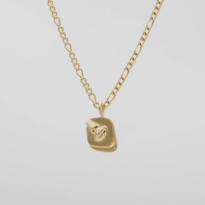 Gold chain with a textured rectangular pendant.