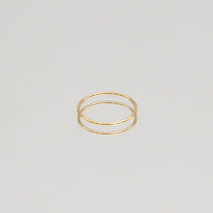 Gold ring with a small diamond.