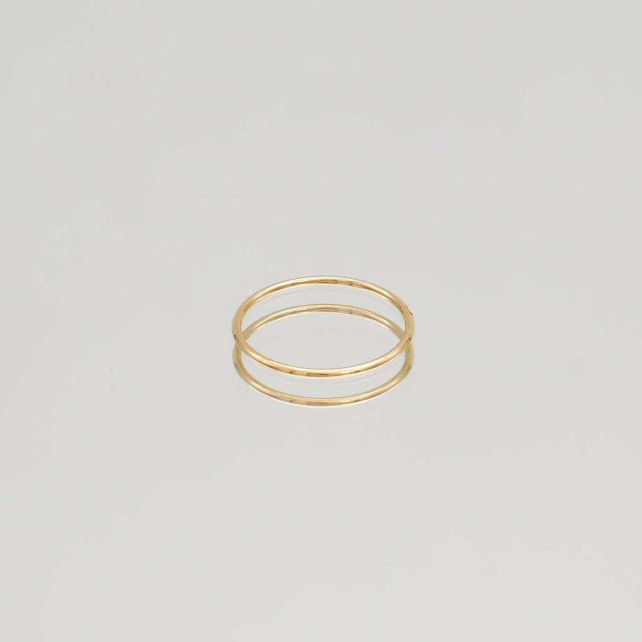 Gold ring with a small diamond.