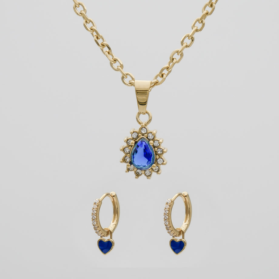 Gold necklace and earrings with blue gems.