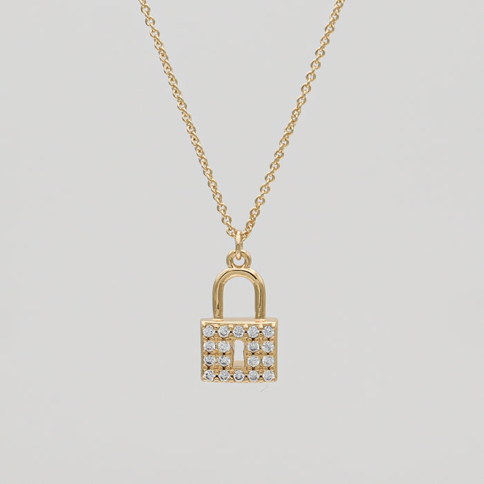 Gold lock necklace with sparkling stones.