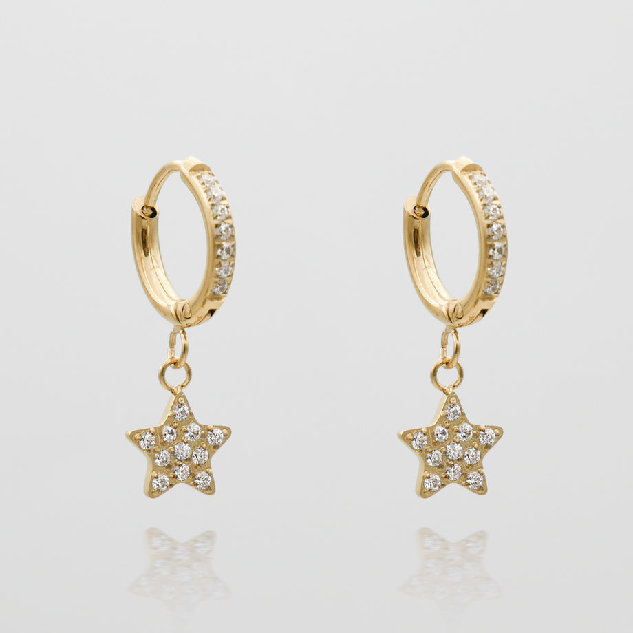 Gold hoop earrings with star-shaped pendants.