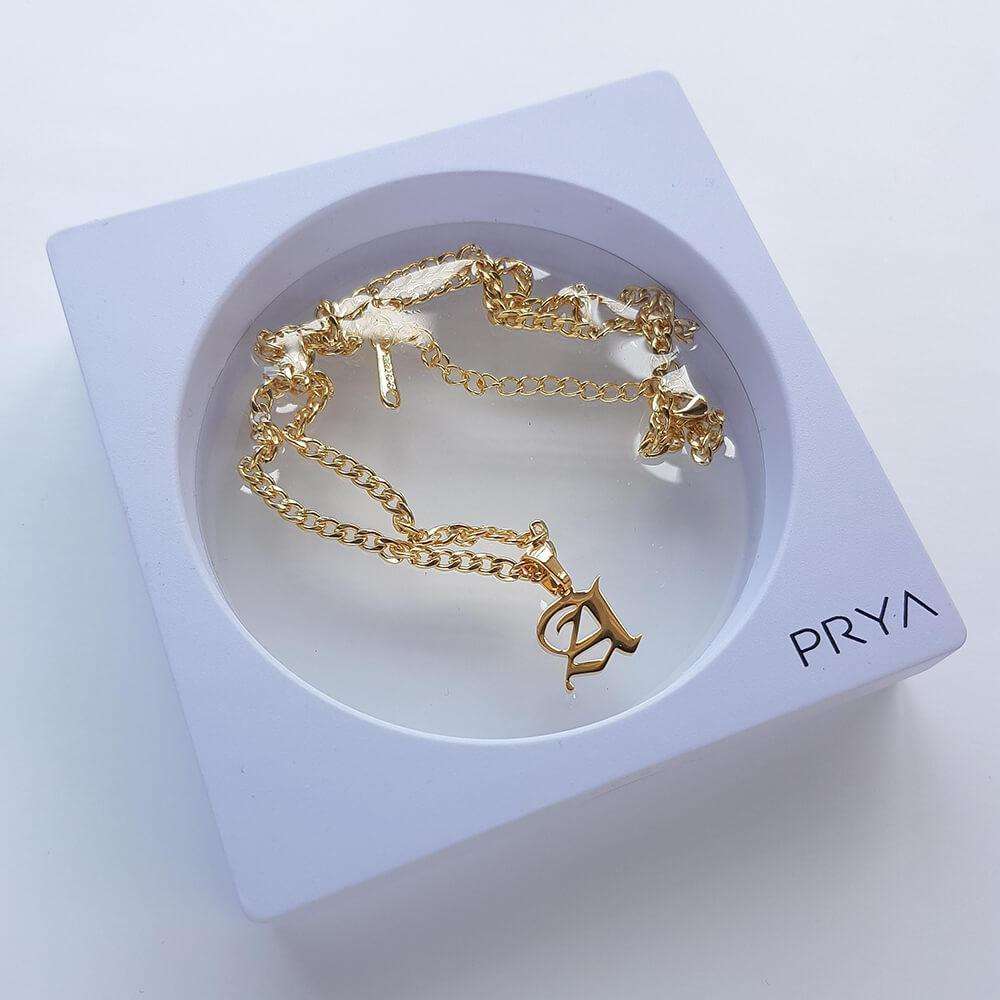 http://prya.co.uk/cdn/shop/products/cubana-initial-necklace-prya-22879339_1200x1200.jpg?v=1620397879