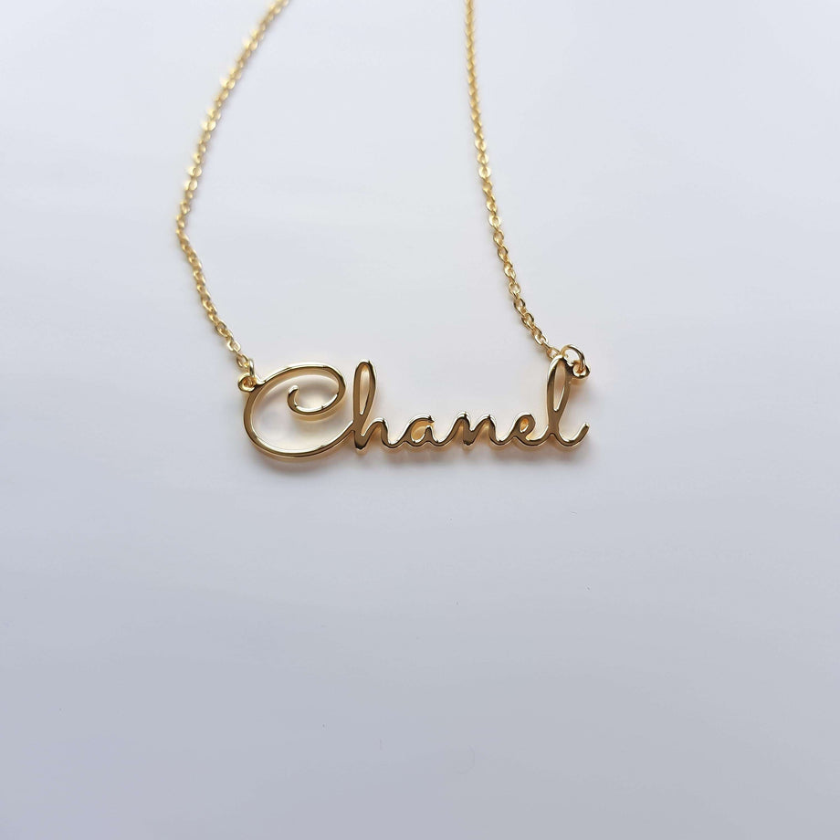 Gold Name Necklace that says Channel