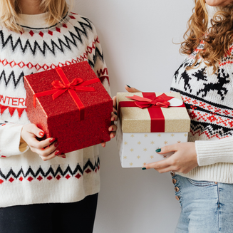 Personalised Gifts for Friends - Two women holding gift boxes together