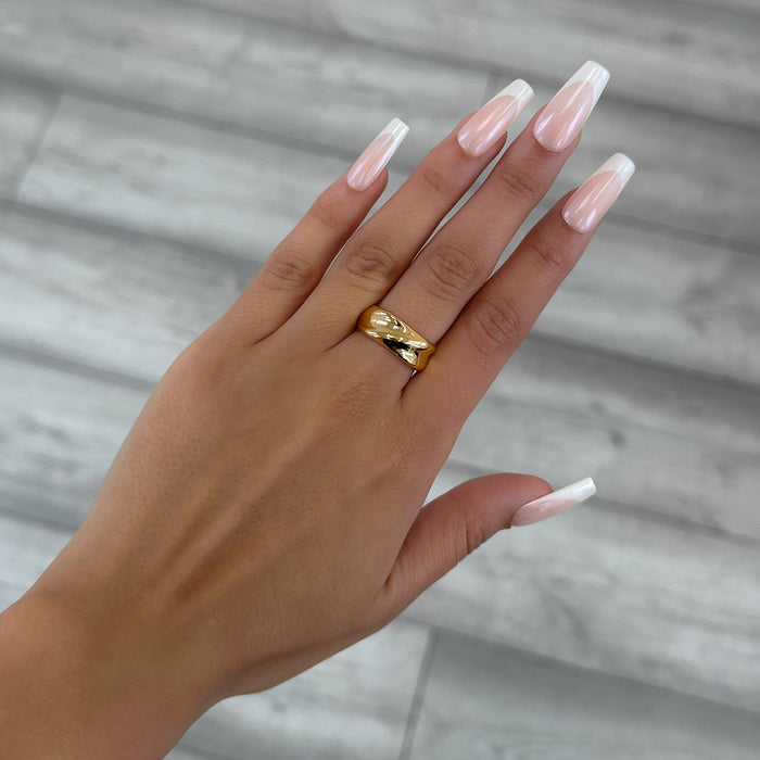 model wearing Amelie Band Ring, featuring smooth lines and polished finish, crafted in 18k Gold plated stainless steel from Prya