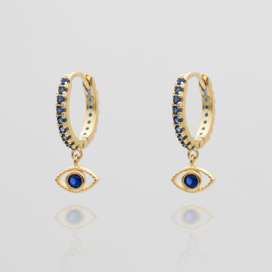 gold evil eye huggie earring paved with sapphire