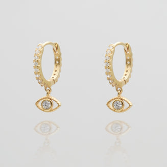 gold evil eye huggie earring paved with CZ stones