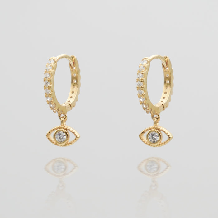 gold evil eye huggie earring paved with CZ stones