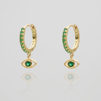 gold evil eye huggie earring paved with emerald