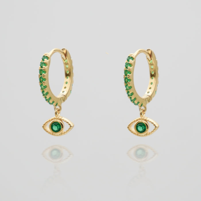 gold evil eye huggie earring paved with emerald