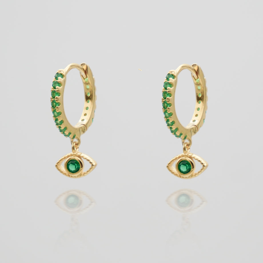 gold evil eye huggie earring paved with emerald