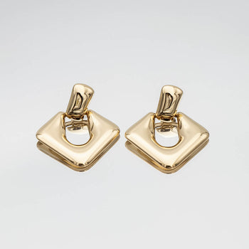 Anika Earrings are stunning Gold plated Drop earrings featuring a sleek, modern door knocker design from prya