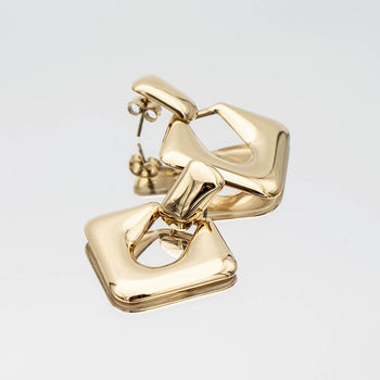 Anika Earrings are stunning Gold plated Drop earrings featuring a sleek, modern door knocker design from prya