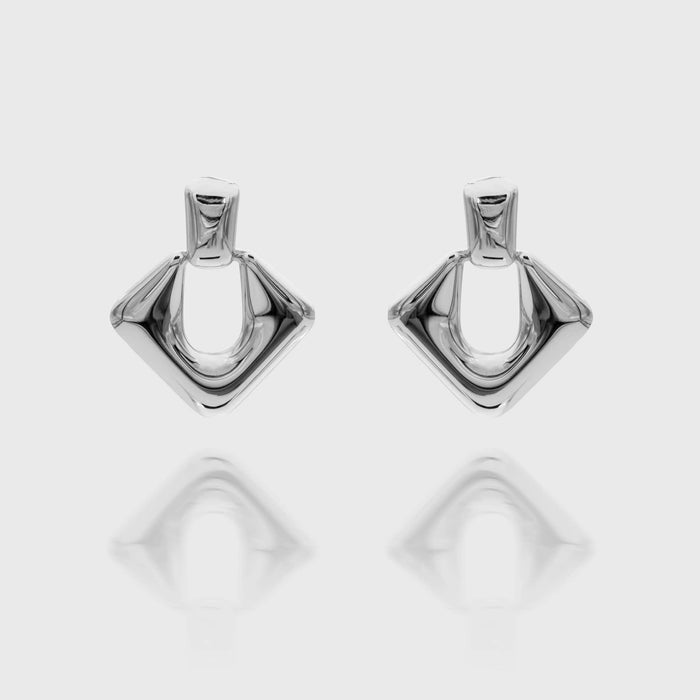 Anika Earrings are stunning silver plated Drop earrings featuring a sleek, modern door knocker design from prya