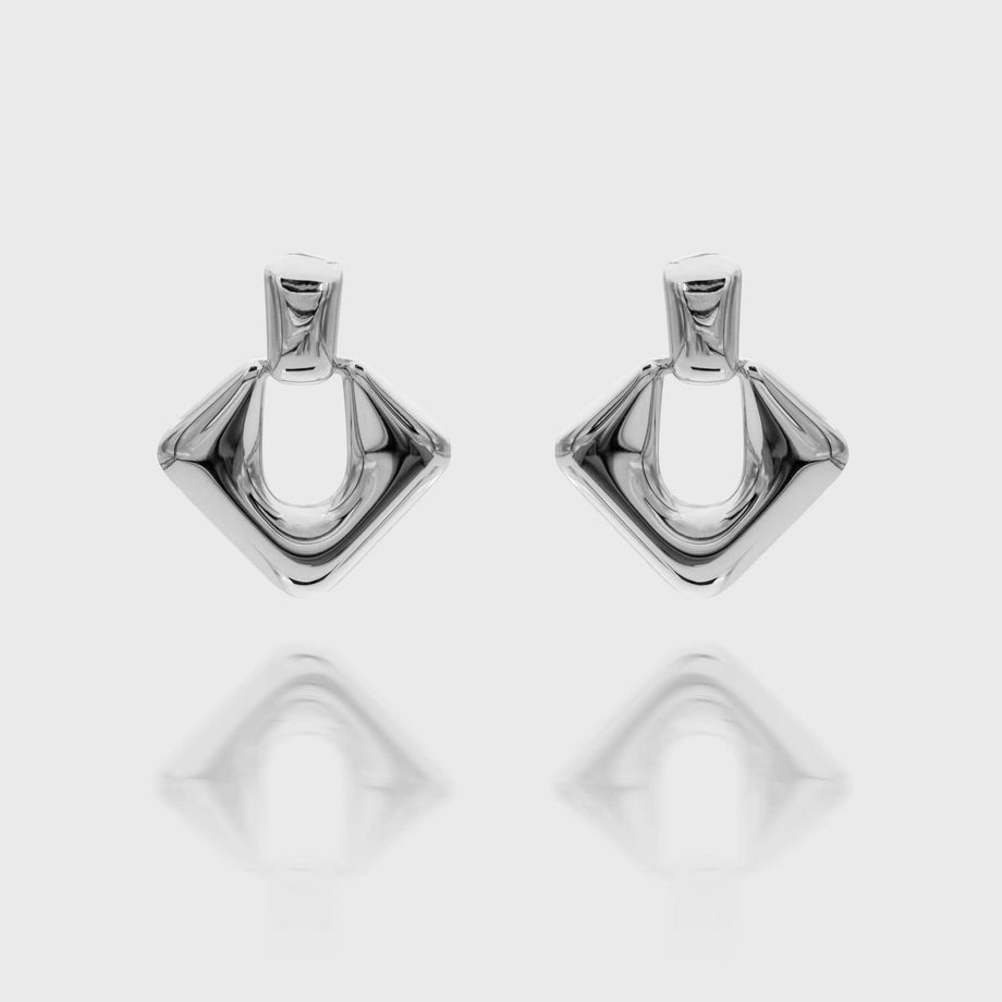 Anika Earrings are stunning silver plated Drop earrings featuring a sleek, modern door knocker design from prya