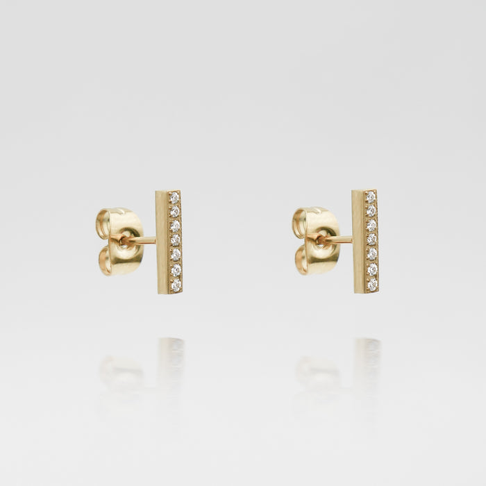 Gold bar earrings with small diamonds.